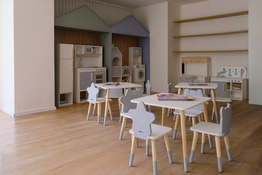 Small tables and chairs in an empty classroom