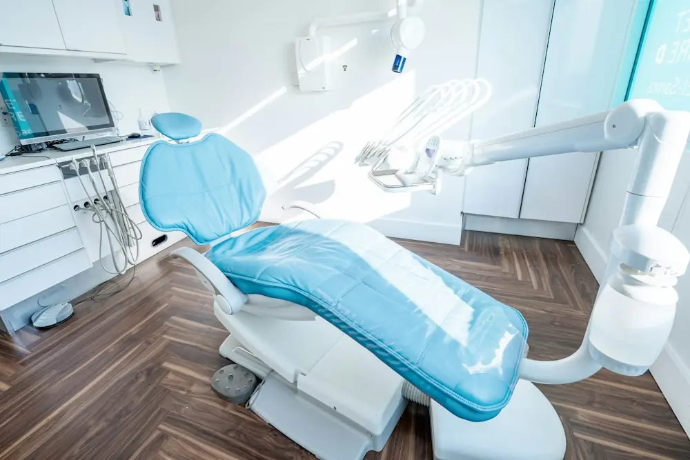 An empty dental chair in afternoon light