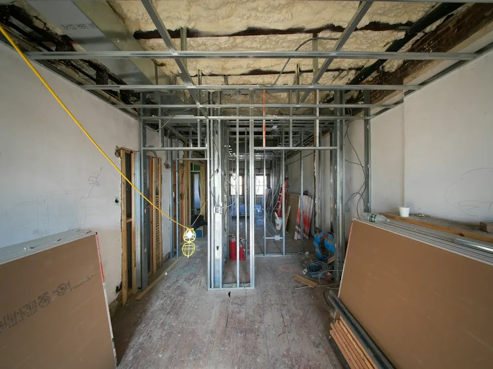Bare metal framing in a gutted room