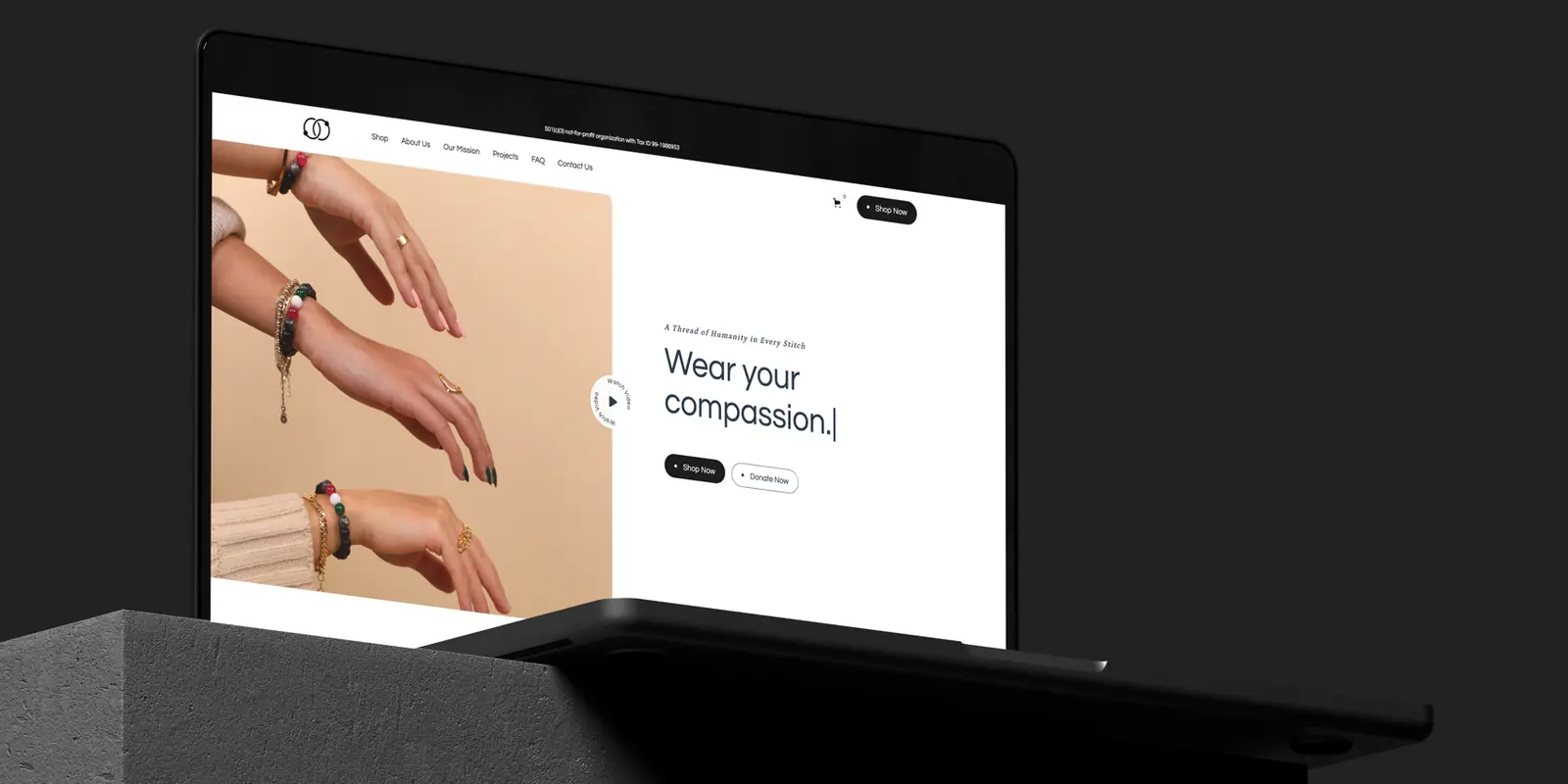 The SoulTies US Co. homepage on a laptop: Wear your compassion, with Shop Now and Donate Now buttons