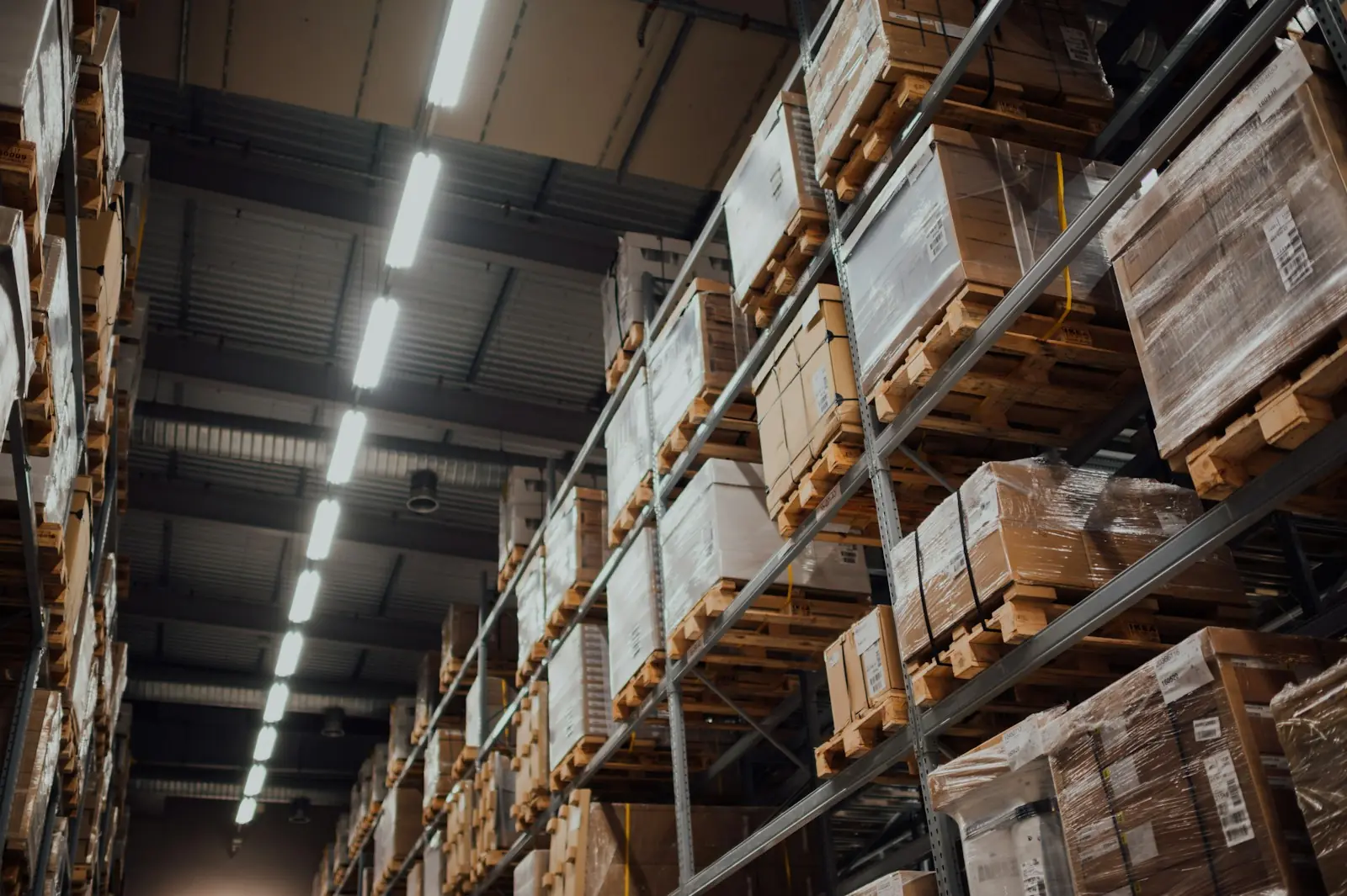 Tall warehouse shelves stacked with boxed stock
