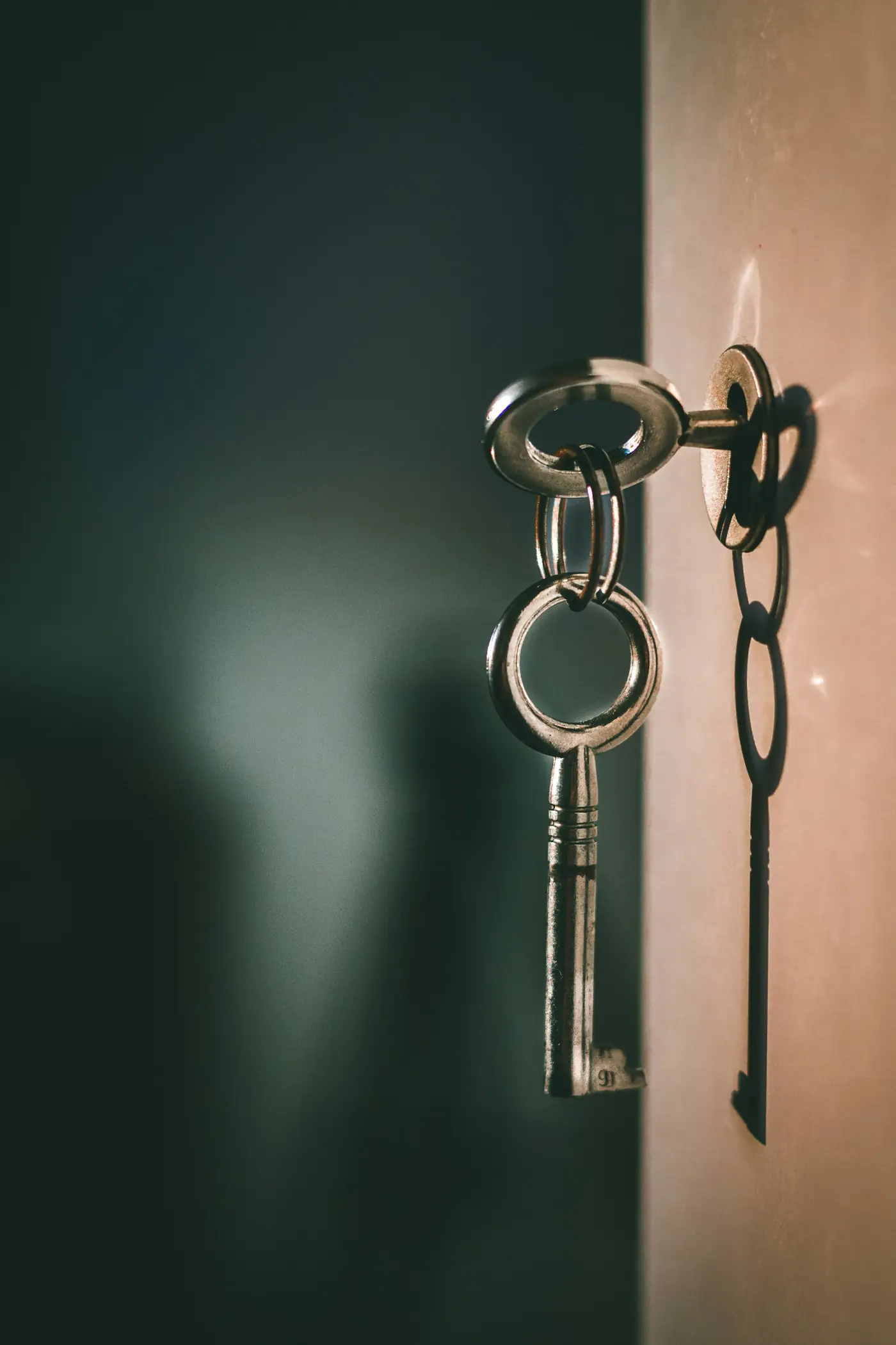 Keys on a ring hanging from a front door lock