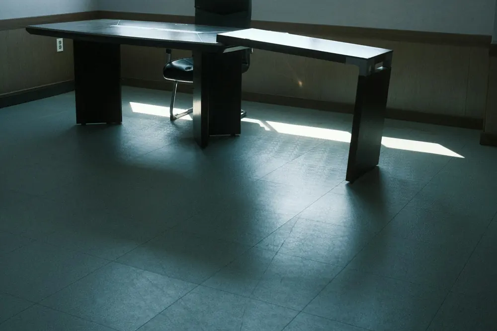 An empty desk in a dim office