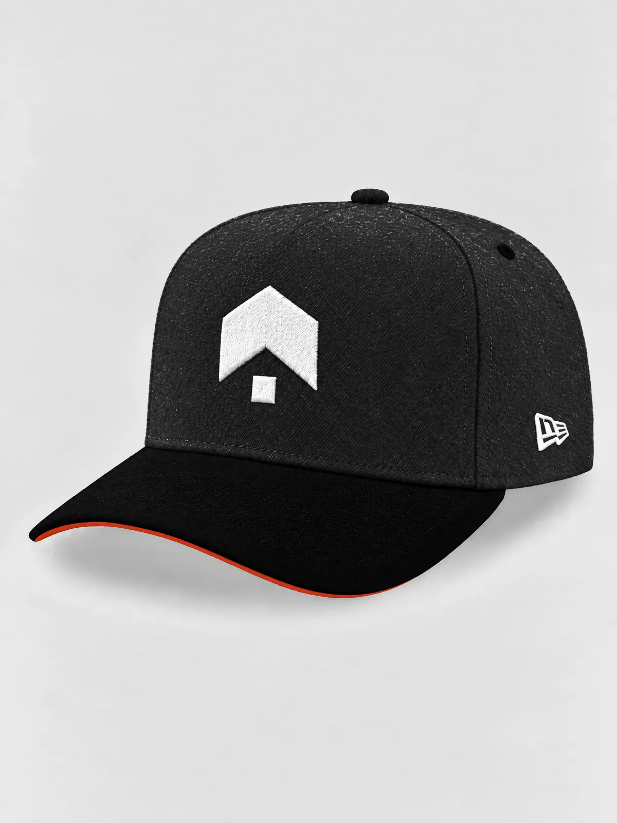 The dark grey A-Frame from the left: a heather grey crown, a black brim with a red-orange underside, and the Brillion mark and the maker's flag embroidered in white