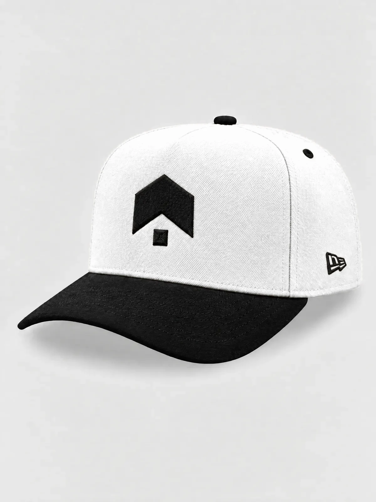 The white A-Frame from the left: a white crown and black brim, with the Brillion mark and the maker's flag embroidered in black