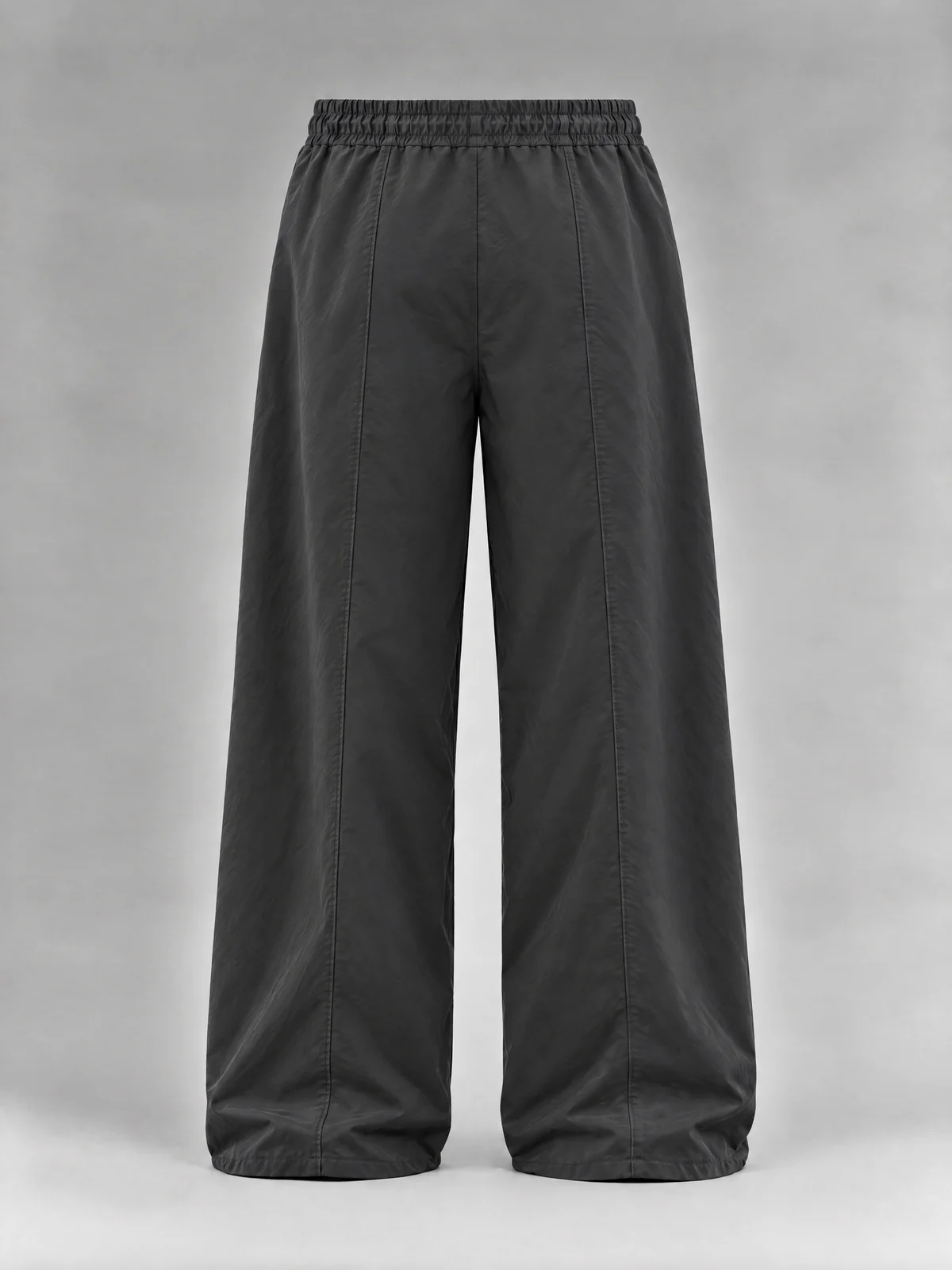 The back of the dark grey wide-leg pants: a plain seat and a seam down each leg