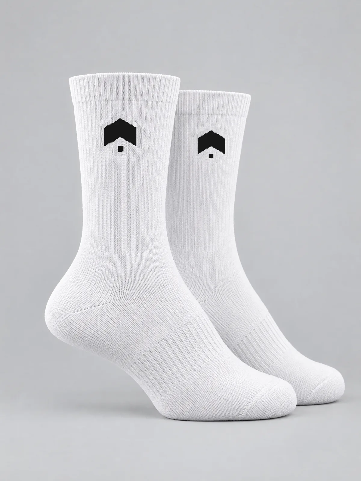 A pair of white crew socks, one from each side, our mark knitted in black on both