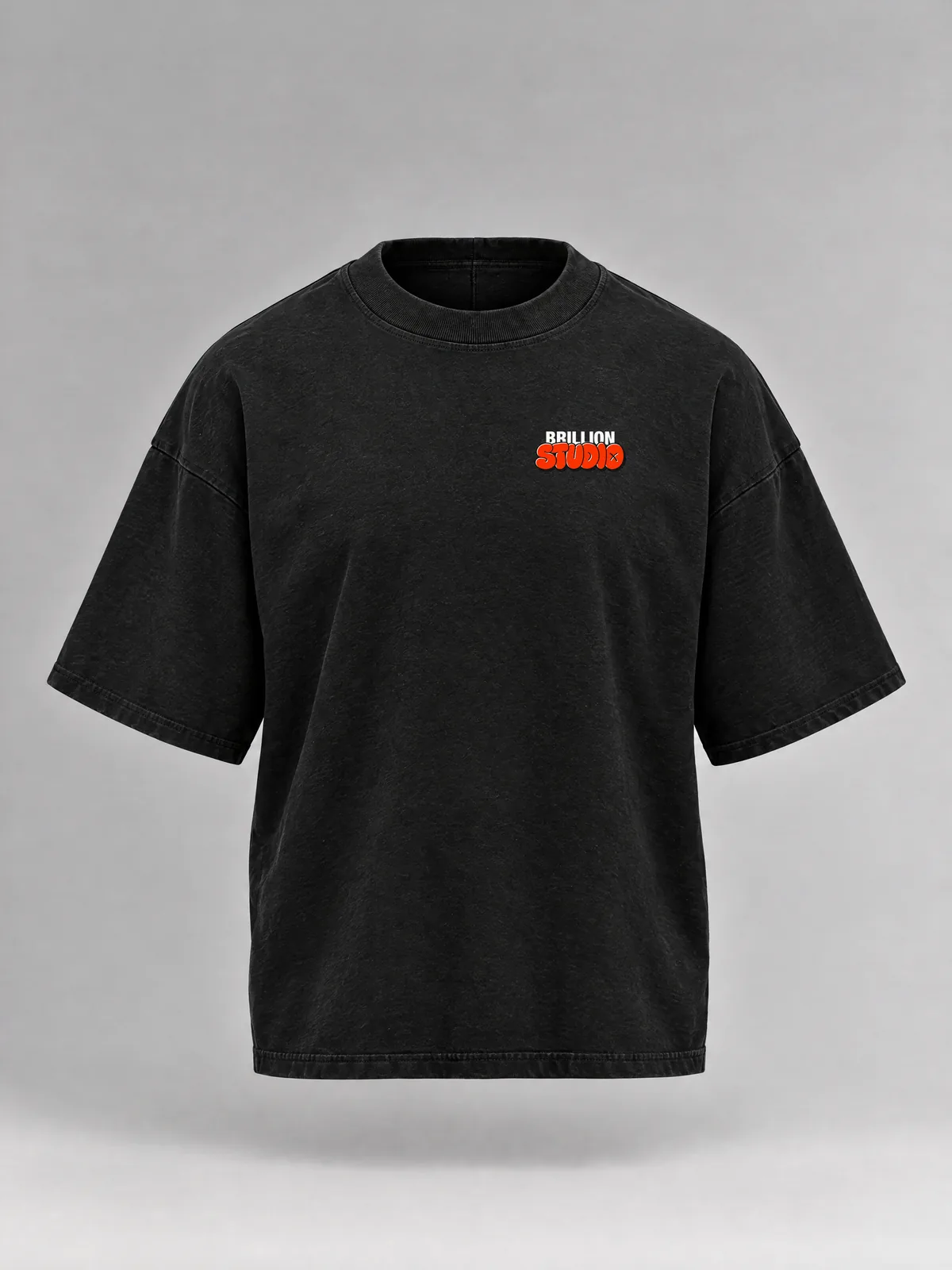 The black Brillion Studio tee, boxy and short-sleeved, with the STUDIO print small on the left chest