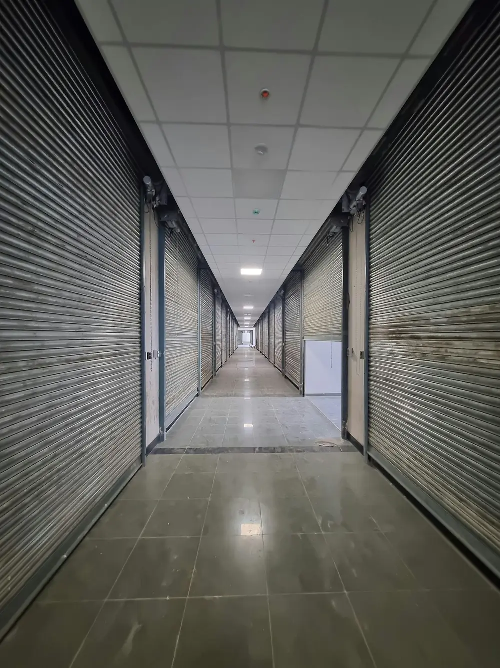 A long aisle of closed unit doors